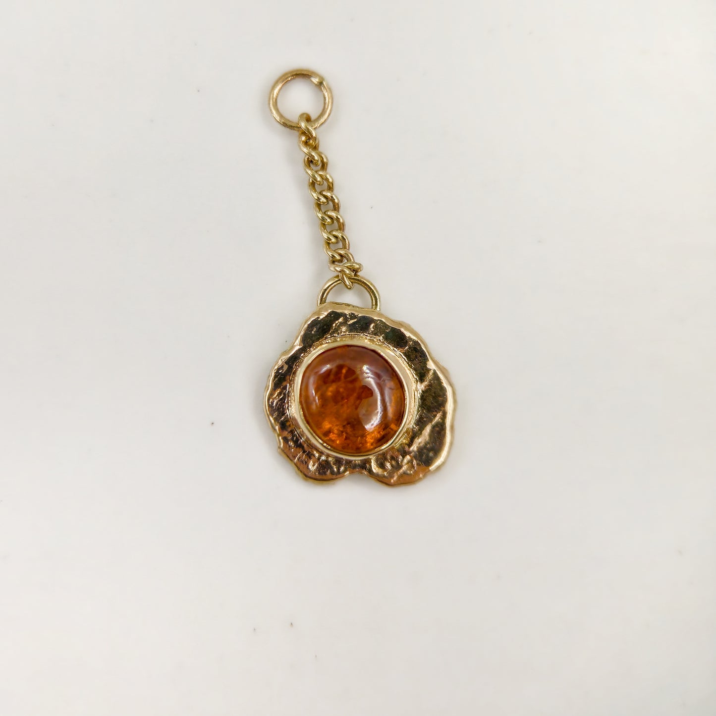 Orange garnet set in solid 9ct yellow gold  - Charm