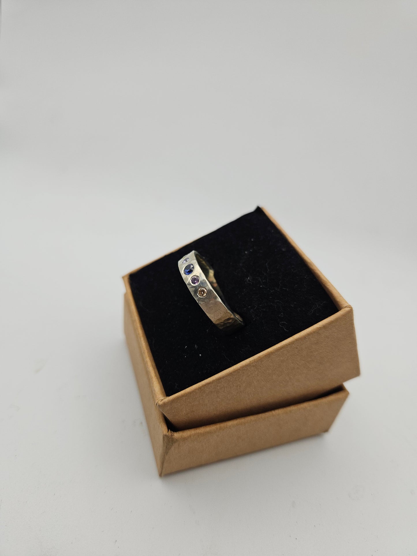 Hammered silver band with 5 flush set CZ- Size T