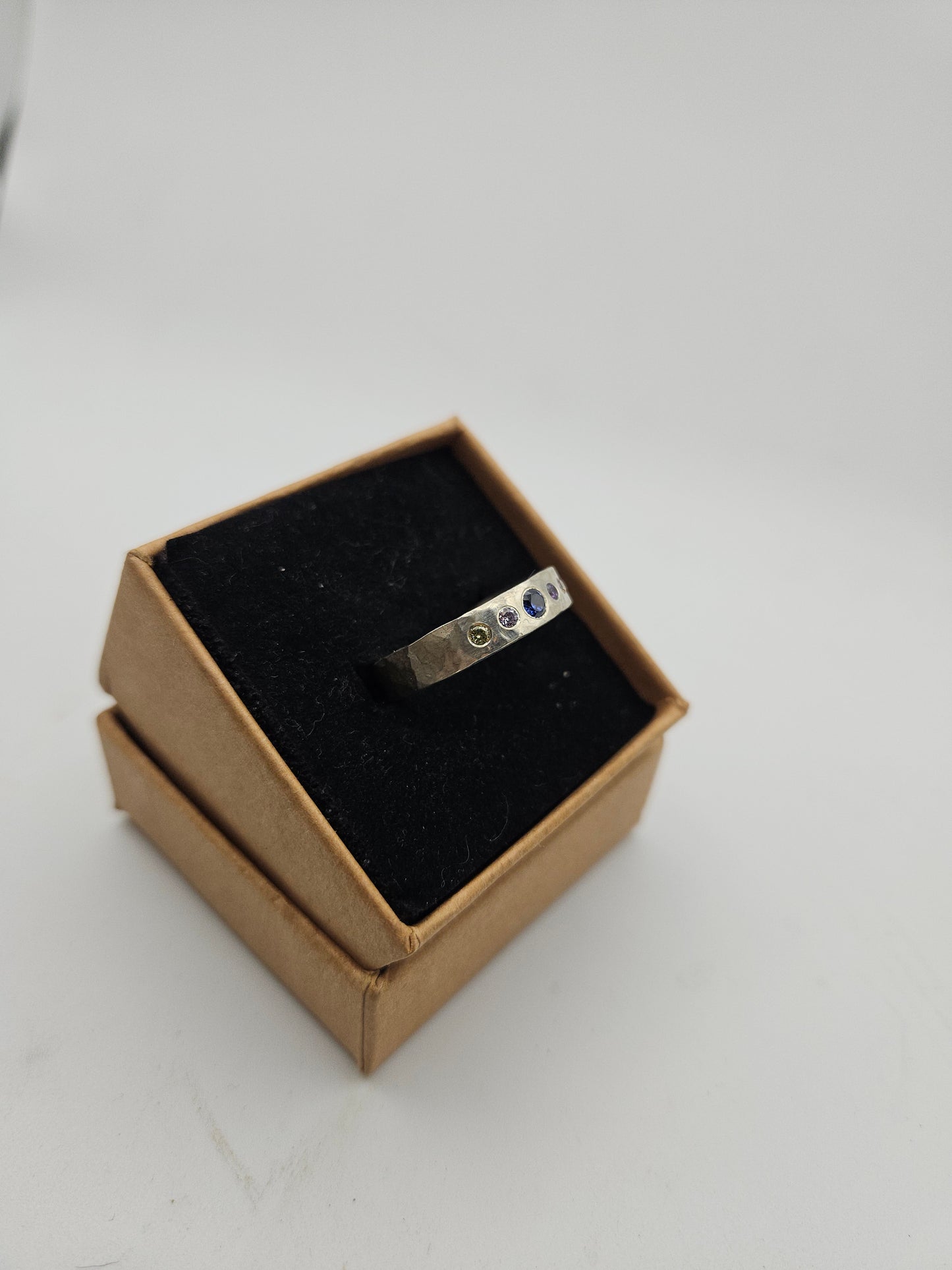 Hammered silver band with 5 flush set CZ- Size T