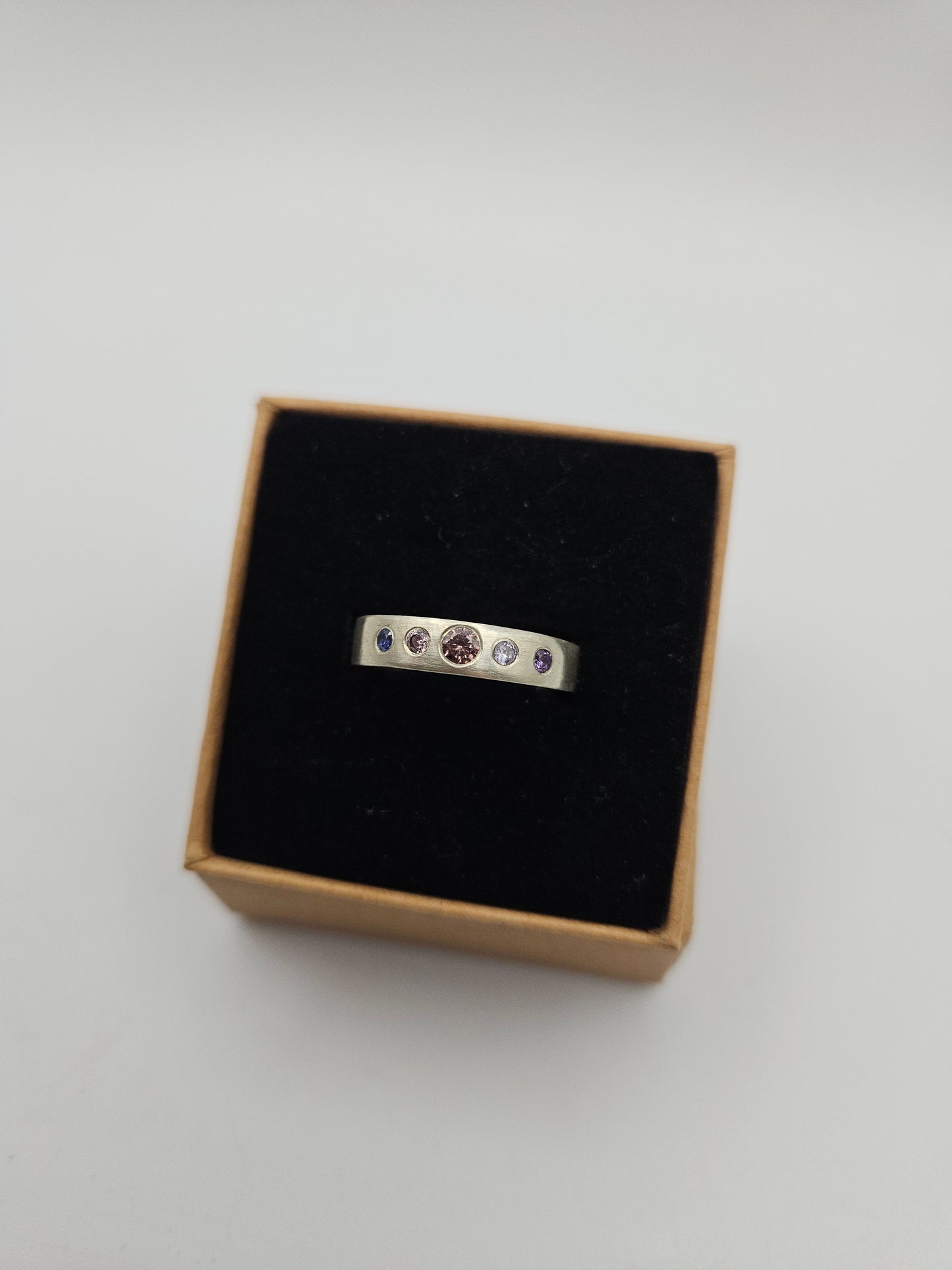 Brushed silver band with 5 flush set CZ- Size O (UK)