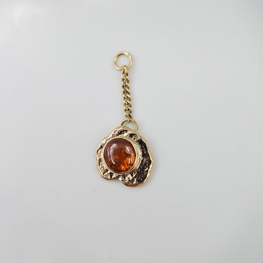 Orange garnet set in solid 9ct yellow gold  - Charm