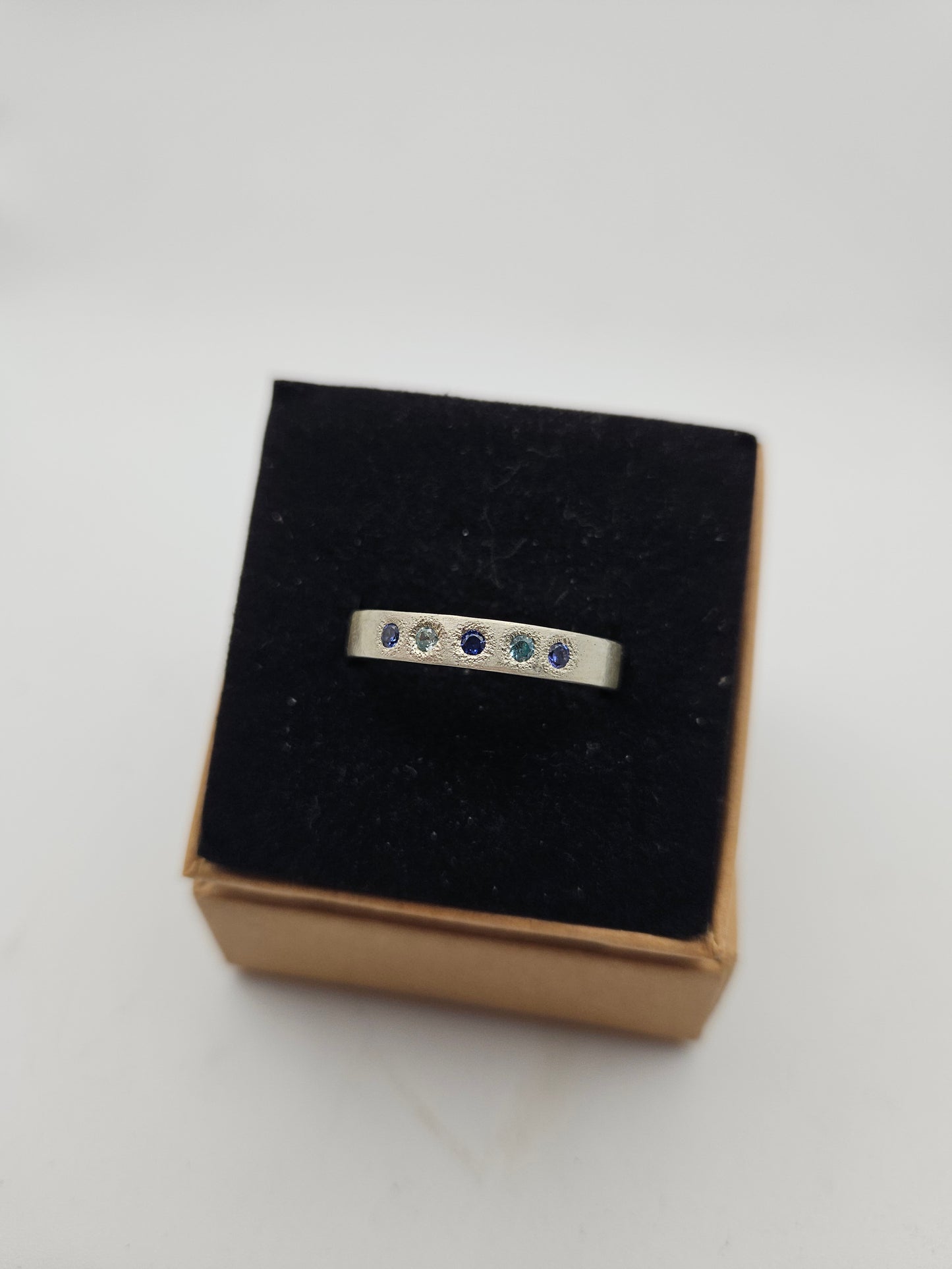 Hammered silver band with blue flush set CZ- Size U 3/4
