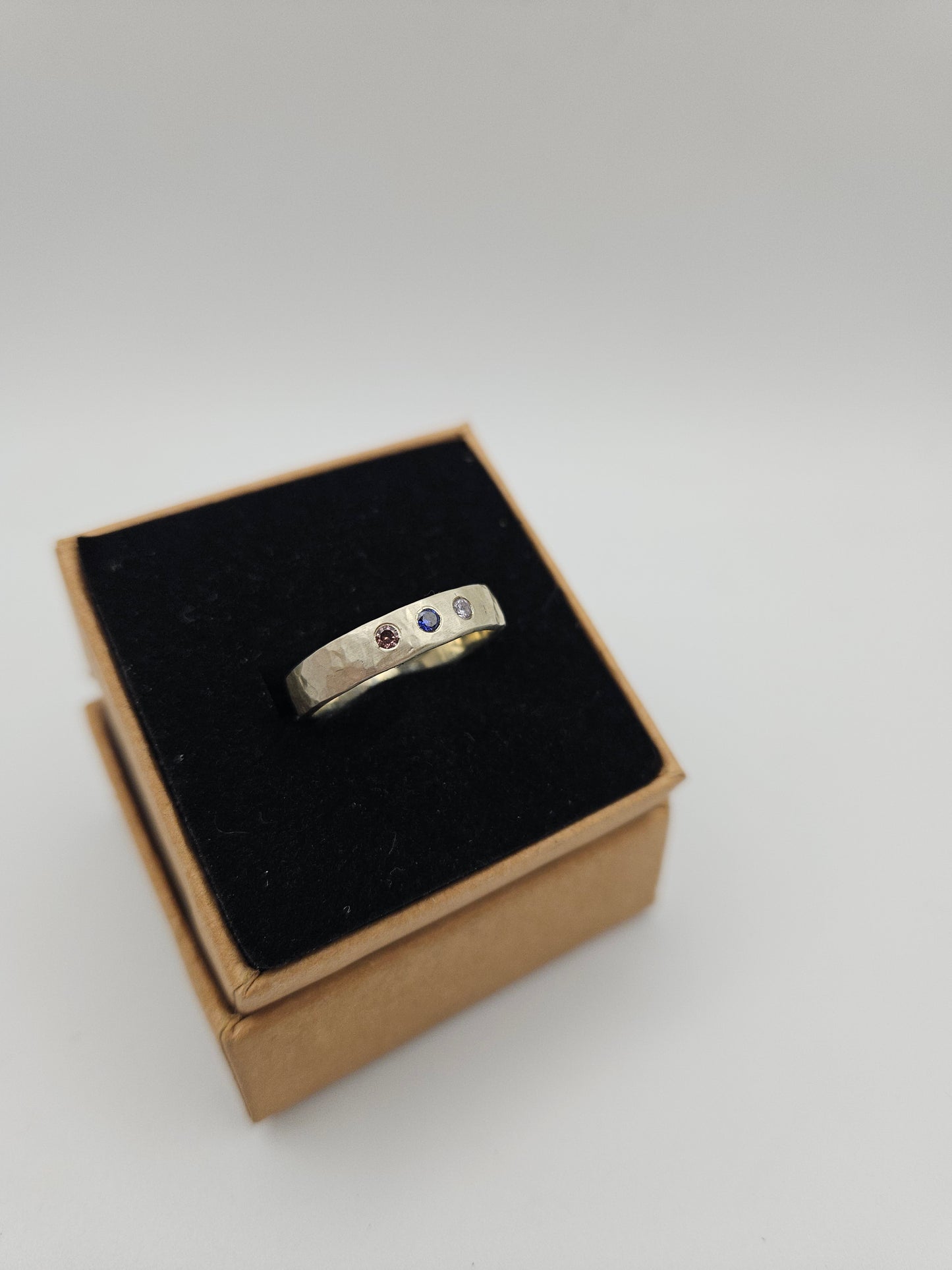 Hammered silver band with 3 flush set CZ- Size P
