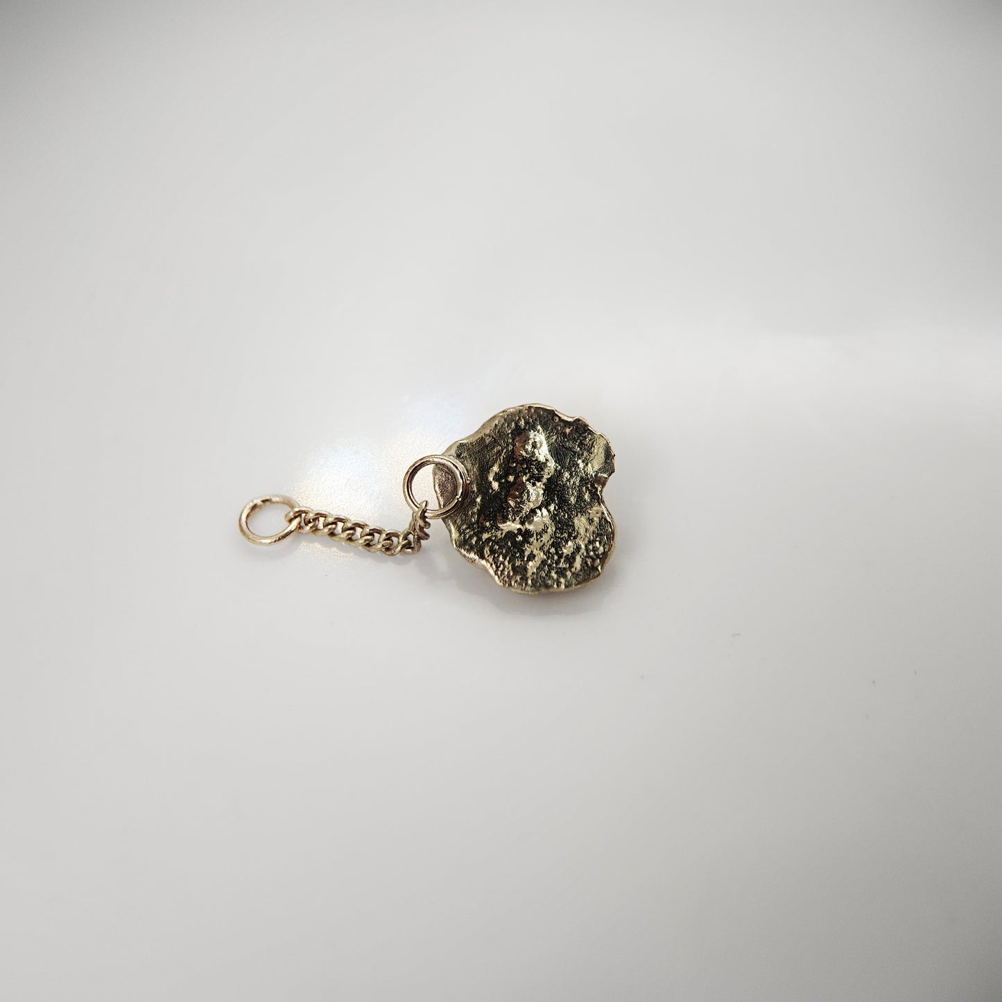 Orange garnet set in solid 9ct yellow gold  - Charm