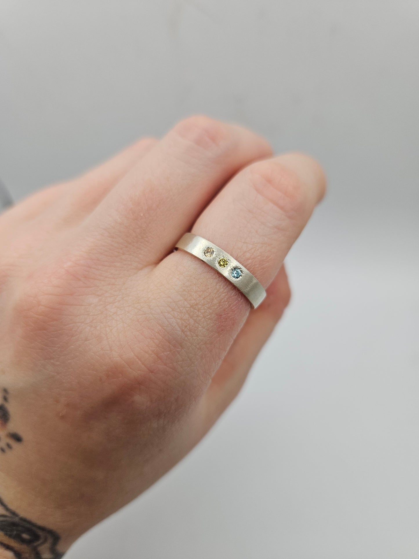 Brushed silver band with 3 flush set CZ- Size R