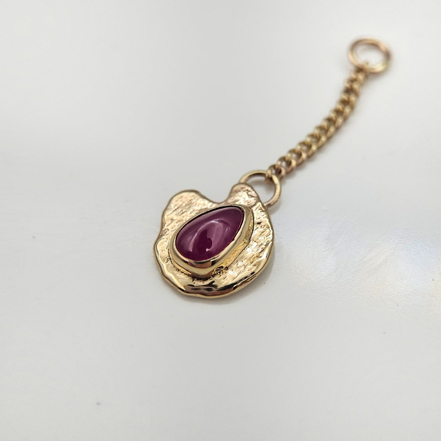 Ruby set in solid 9ct yellow gold  - Charm
