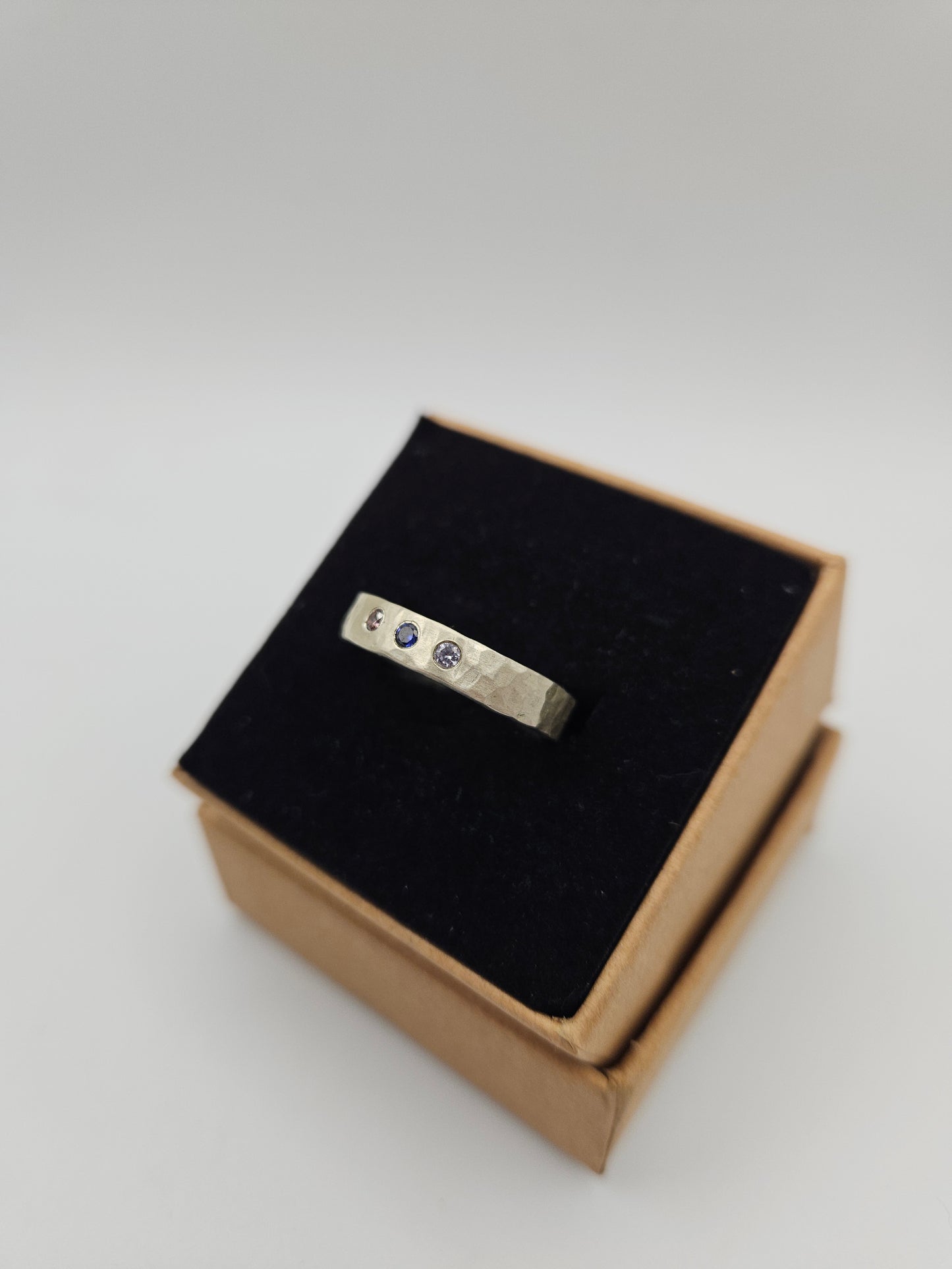Hammered silver band with 3 flush set CZ- Size P