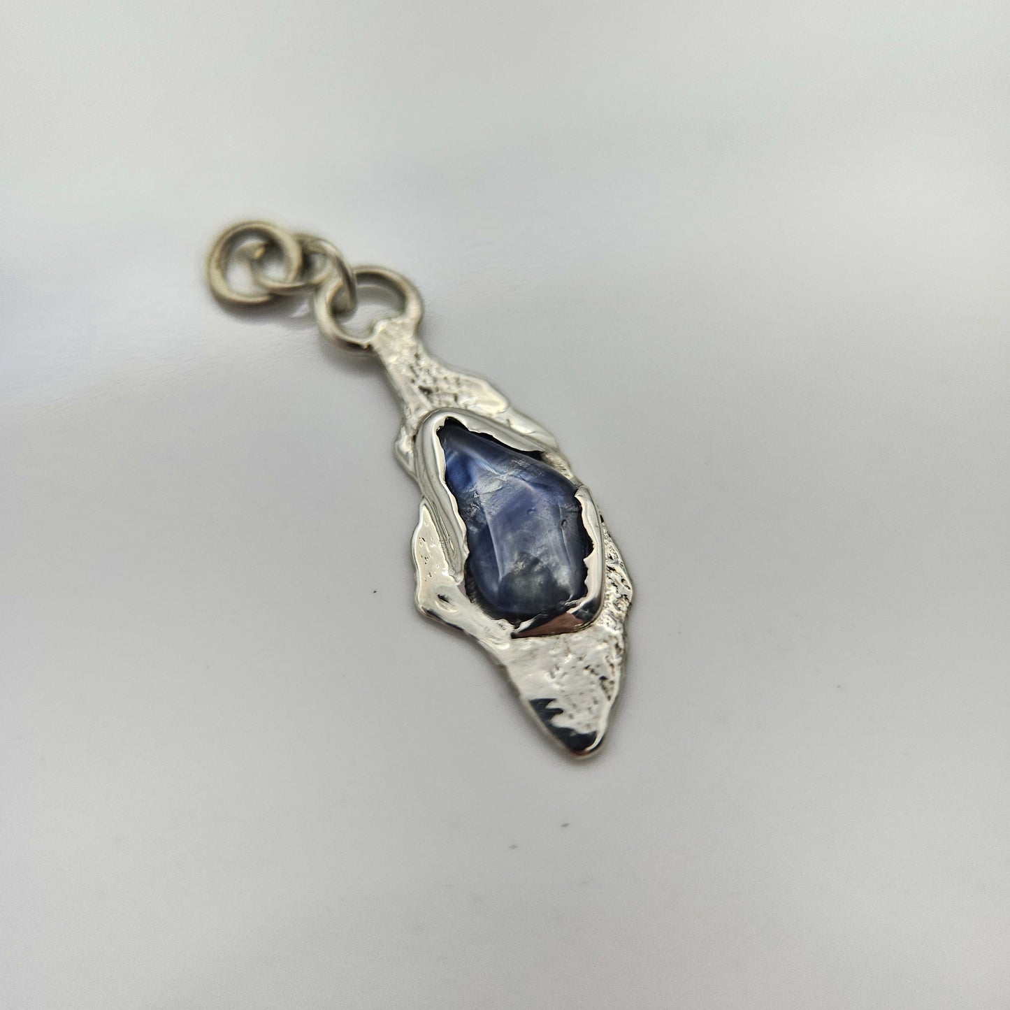 Blue striped Sapphire set in solid 9ct white gold  - Charm