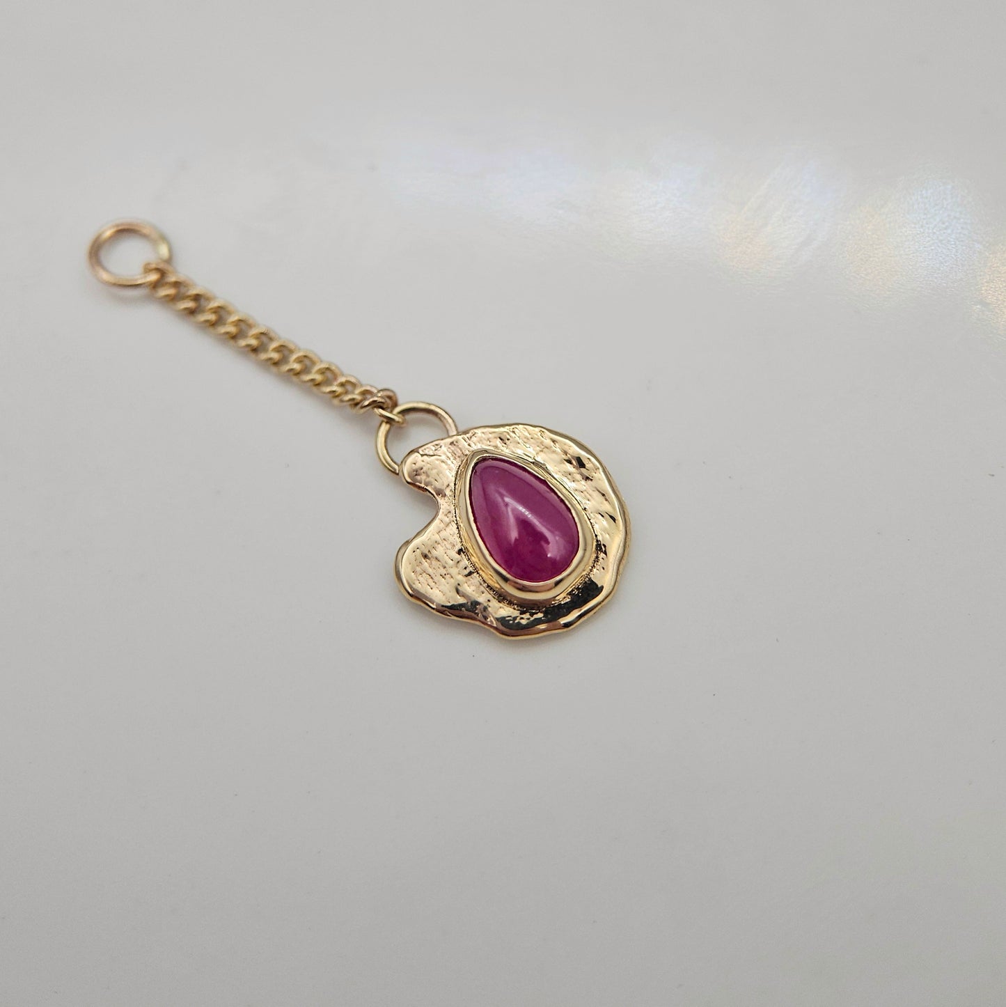Ruby set in solid 9ct yellow gold  - Charm